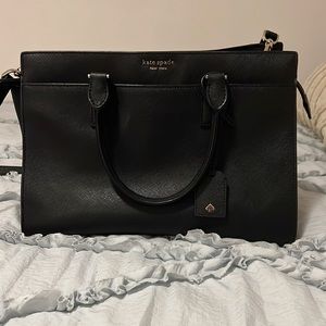 I am personally selling this Black Kate Spade purse because I do not wear it.